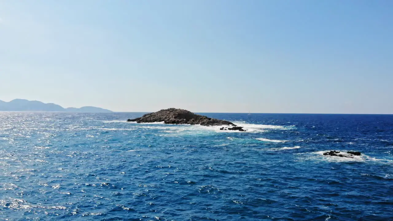 Stunning Blue Ocean Of Jerusalem Beach In Erisos Greece aerial drone shot