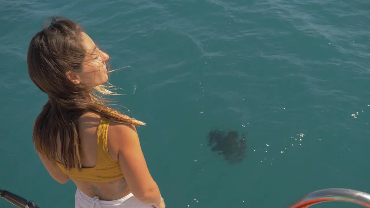 Pretty tourist lady watching a Manta Ray from the surface -Queensland Australia -Midshot