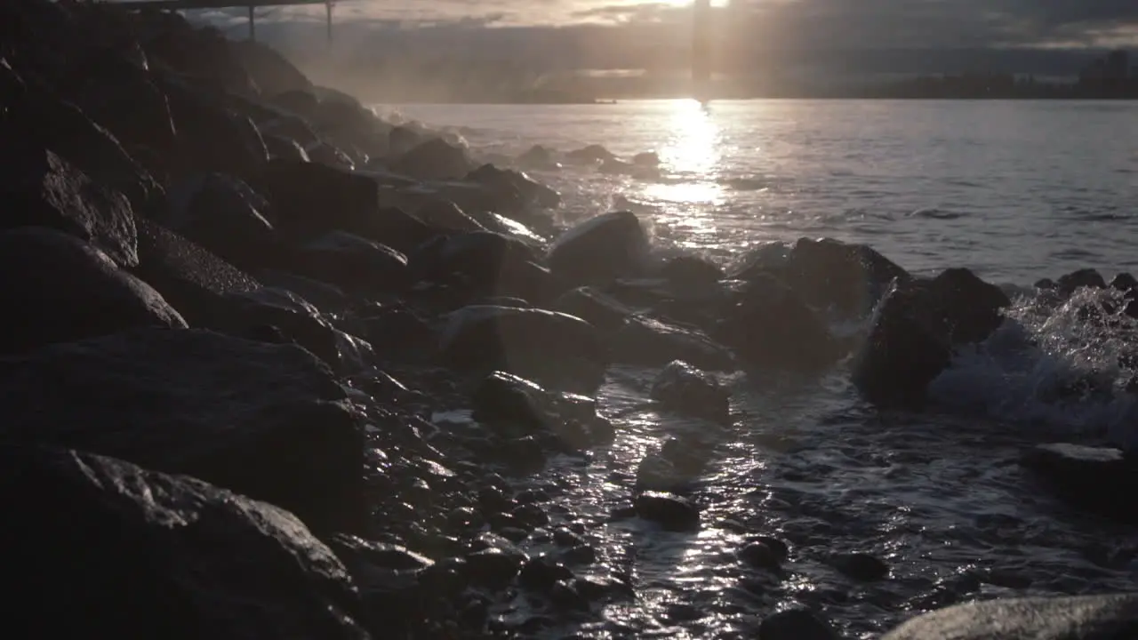 Morning ocean waves splashes rocks on Ambleside beach in Vancouver