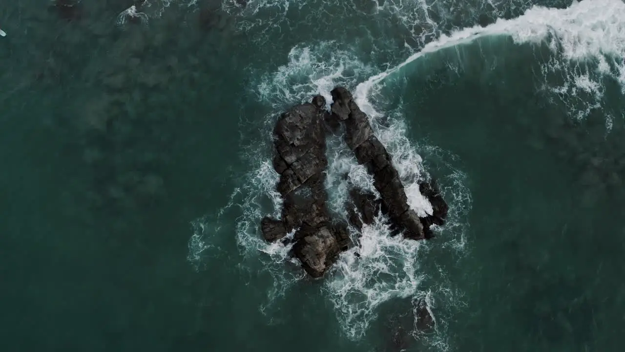 Top down View Of Waves Crashing On Rocks At Puerto Escondido Oaxaca Mexico drone shot