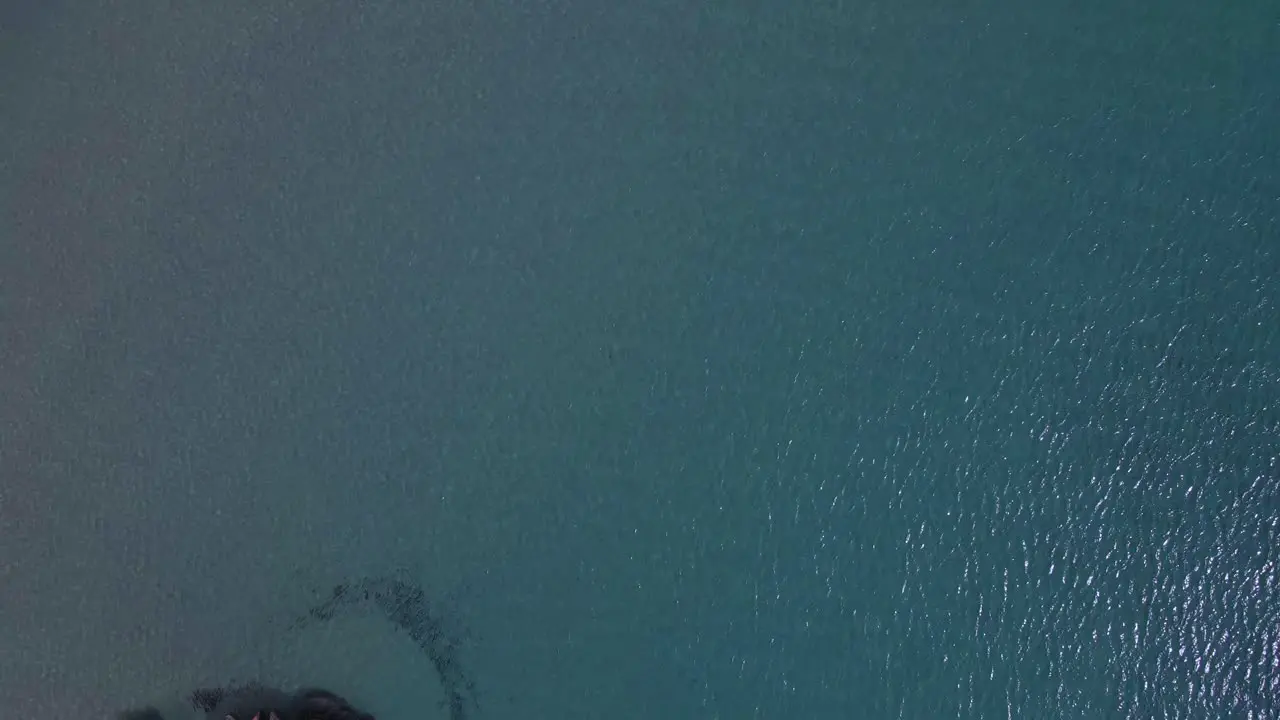 4K overhead backwards moving clip over a shipwreck in the tropical beach of Epanomi Norhtern Greece