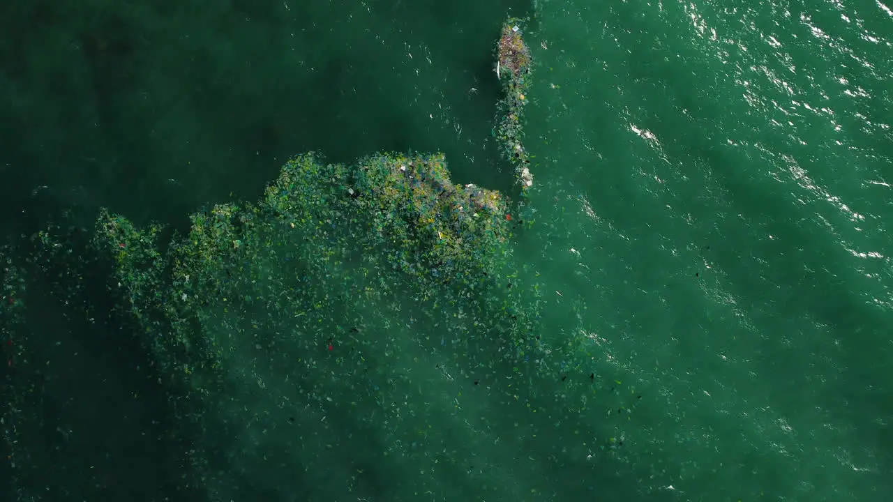 Seascape with disposable plastic bags floating in ocean