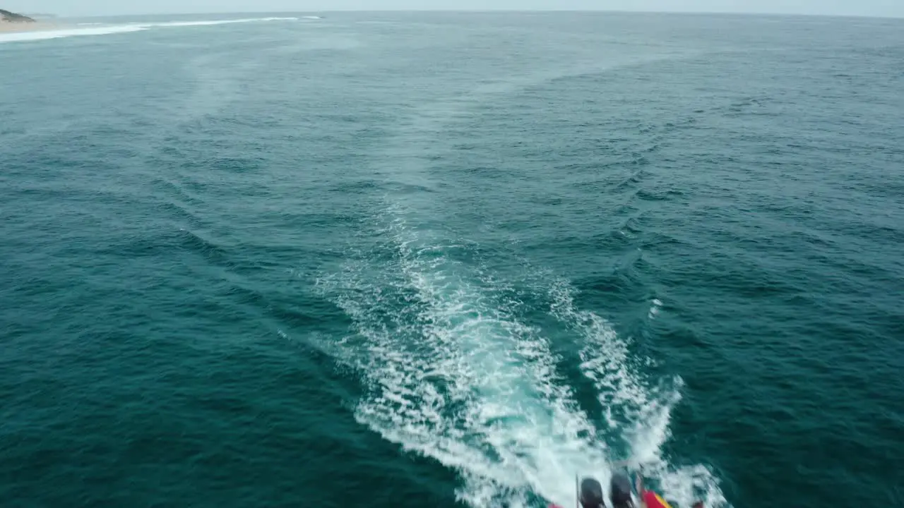 Drone shot flying over a scuba diving boat in Tofo Mozambique