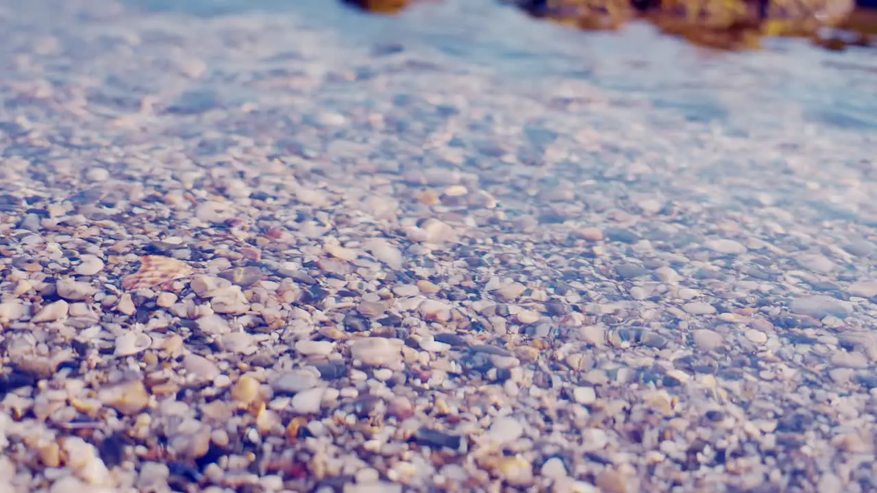 Close up of pebbles under the water surface