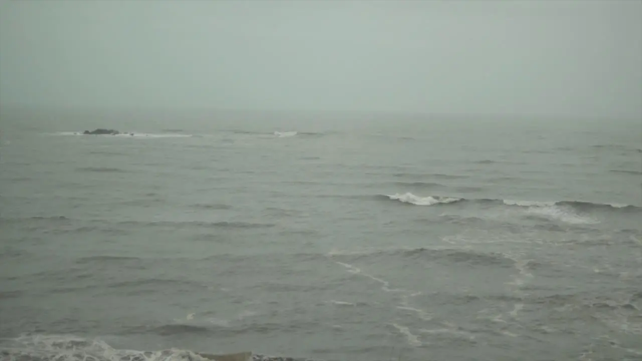 Establishing shot of a seaside in a moody day