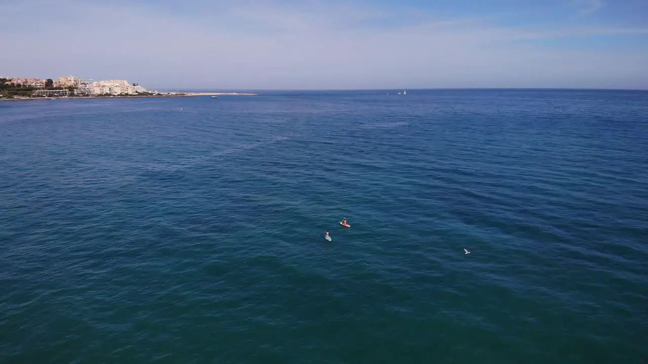 Kayaks In Open Sea At Costa del Sol Beach Estepona Spain aerial drone shot