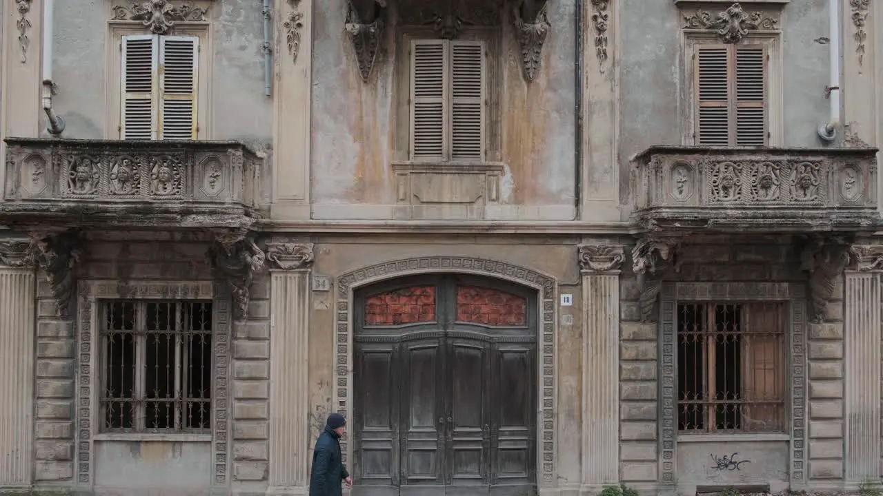 Biella 2022 Old abandoned building with plants growing on the balconies 4k 25fps