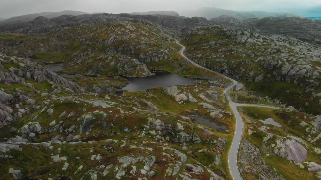 drone flies over mountains in norway