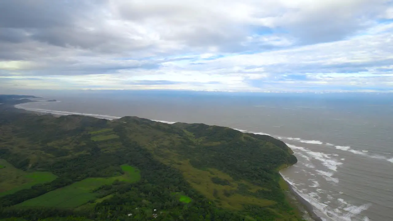 Aerial footage of the coast full of rough brown water after the storm