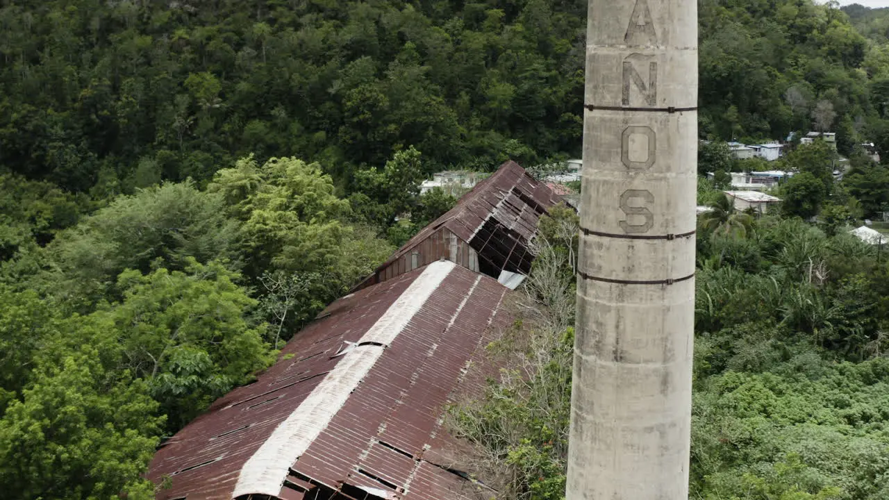 The old chimney stack and collapsing rooftops of a long-abandoned warehouse in Puerto Rico