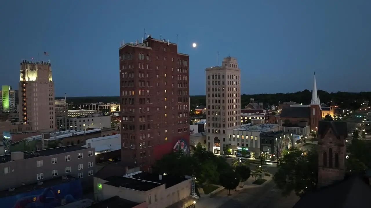 Jackson Michigan downtown at night with drone video moving right to left close up