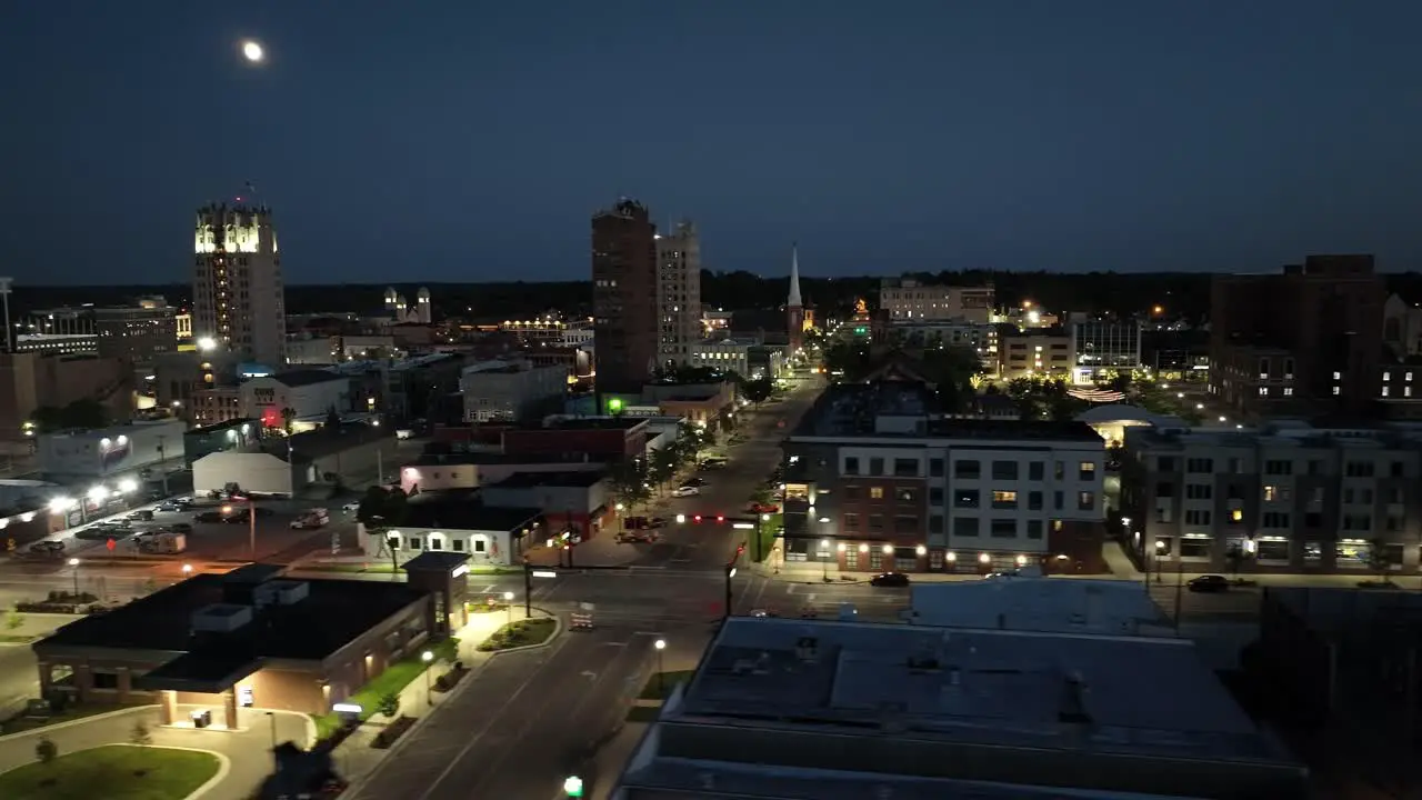 Jackson Michigan downtown at night with drone video wide shot right to left