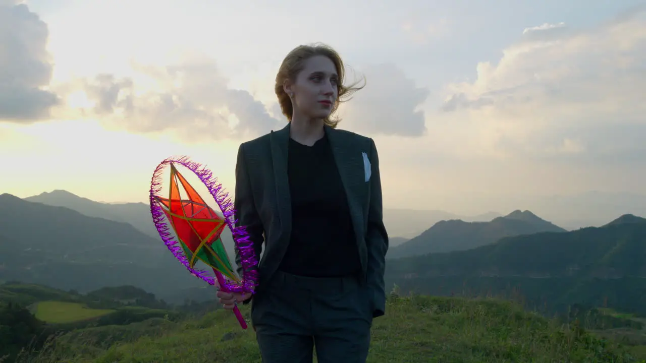 Slow motion shot of a woman walking with a star lantern during the mid-autumn festival