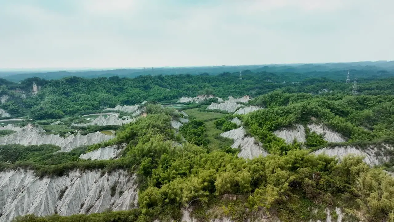 Aerial panorama view of green plants growing on moonscape landscape in Taiwan Tianliao Moon World 田寮月世??