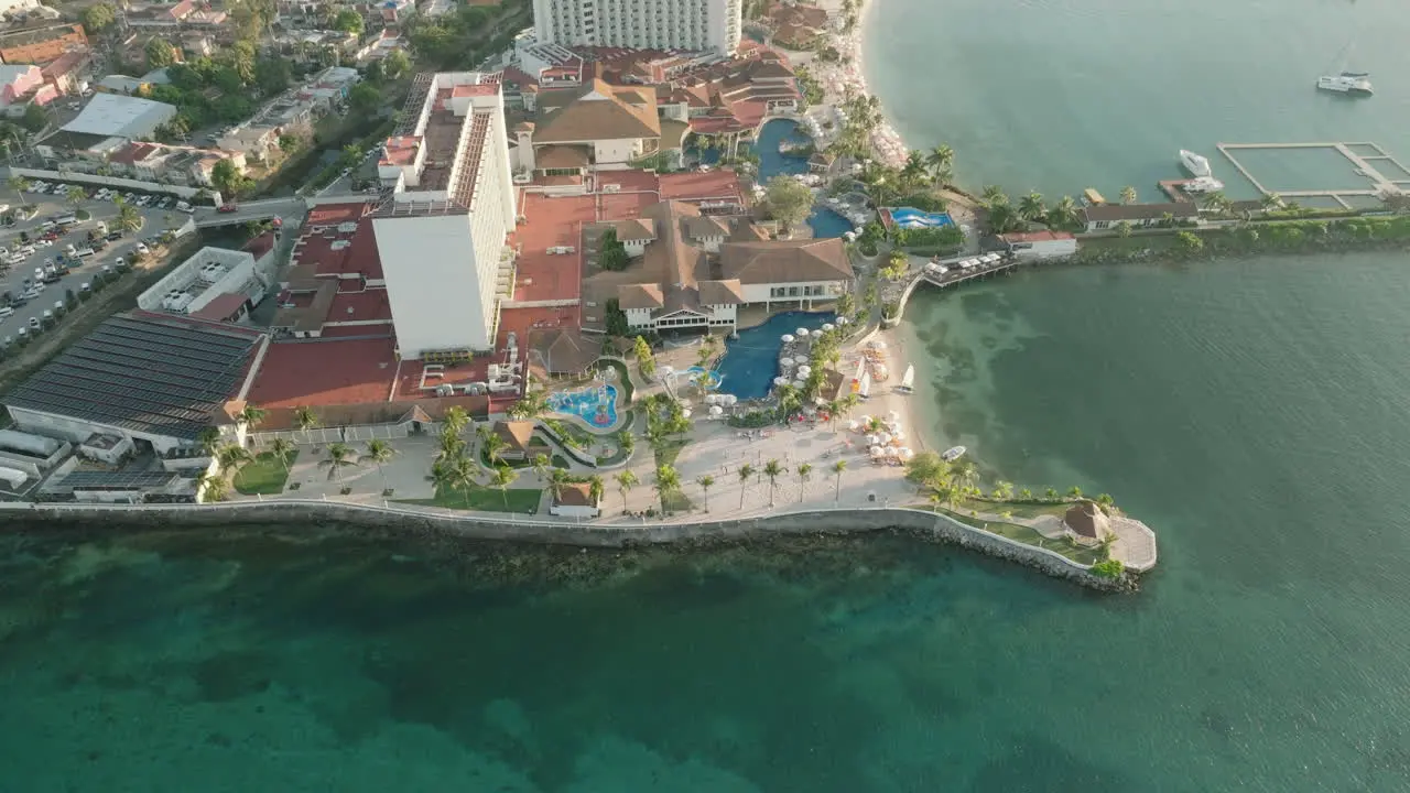 Aerial push in on luxury resort nestled in Ocho Rios Jamaica