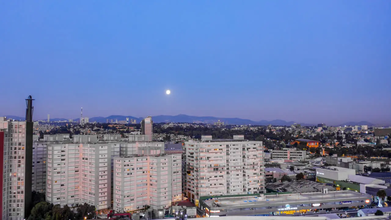 Aerial hyeprlpase of buildings and free way in the San Antonio zone of Mexico City with full moon