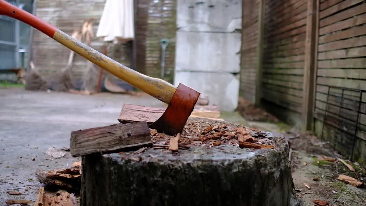 close up in action of chopping wood with axe