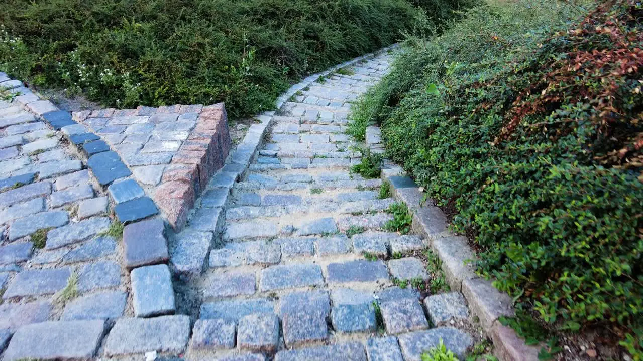 Walking Down Into Cobblestone Steps In The City