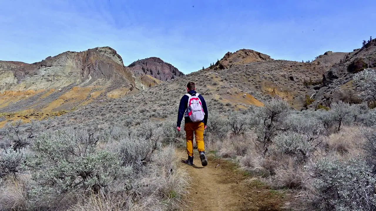 Caucasian Male Hiking the Volcanic Canyons of Kamloops Cinnamon Ridge Adventure