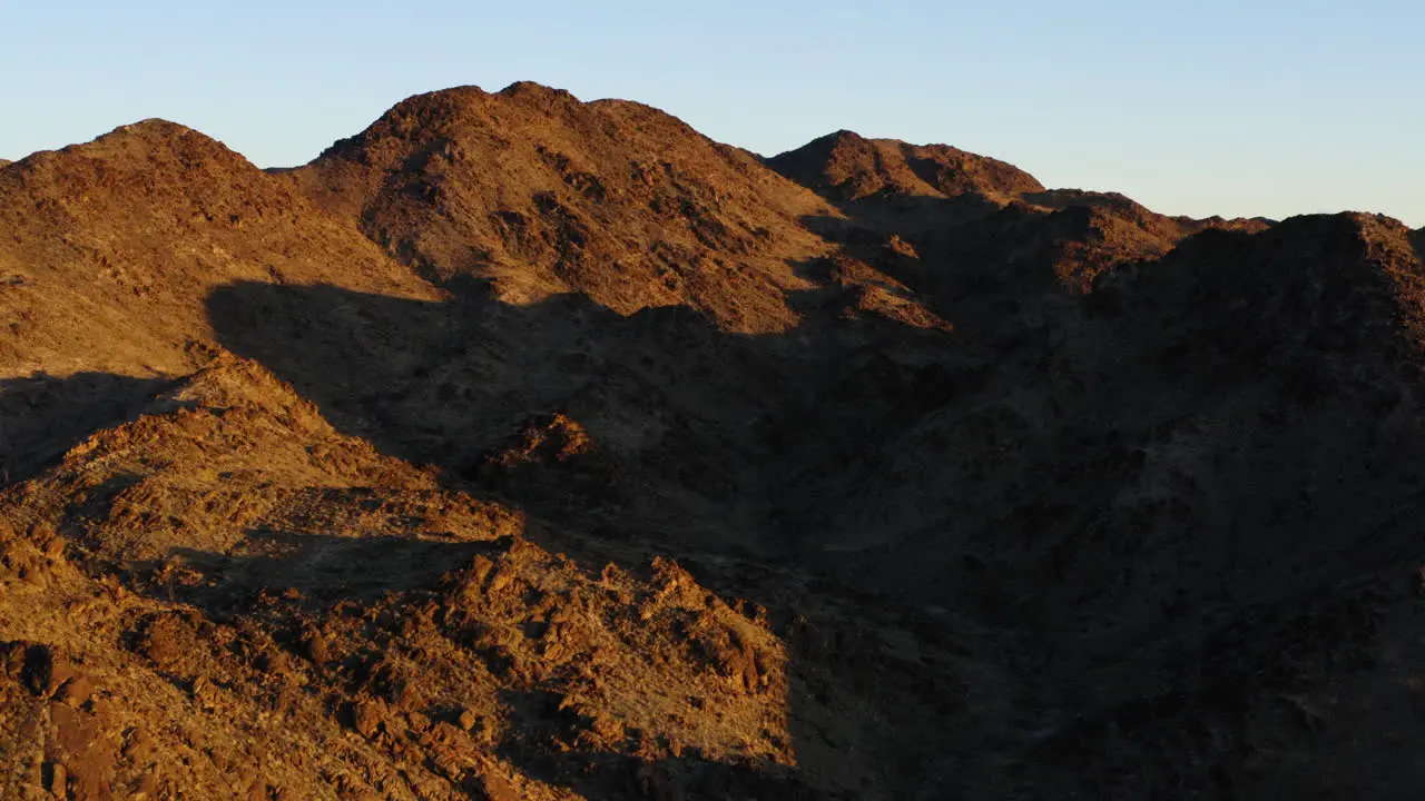 Sunny Day Cast Shadow Over Mountains At Red Cloud Mine Arizona USA Aerial