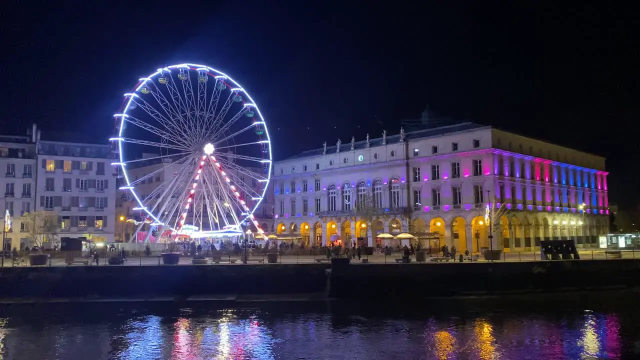 This stock video showcases an impressive view of the Ferris wheel in the beautiful city of Bayona illuminated by Christmas lights