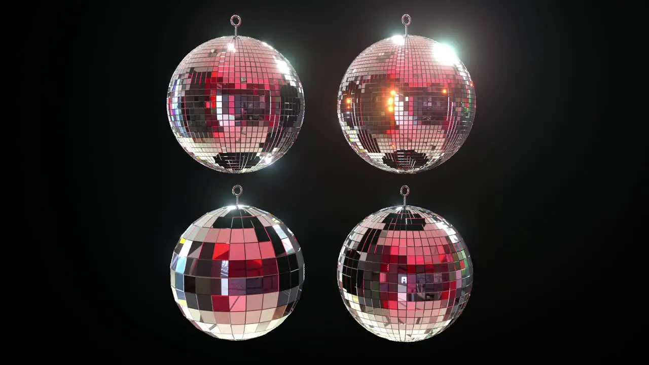 4 different shiny disco mirror balls on black background