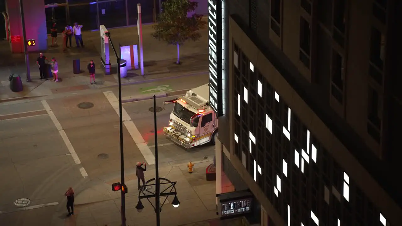 Fire brigade with heavy vehicle on rescue mission in city centre night time emergency