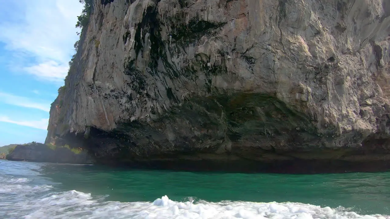 SLOW MOTION | Close up of rock formations coming out of the water in Thailand