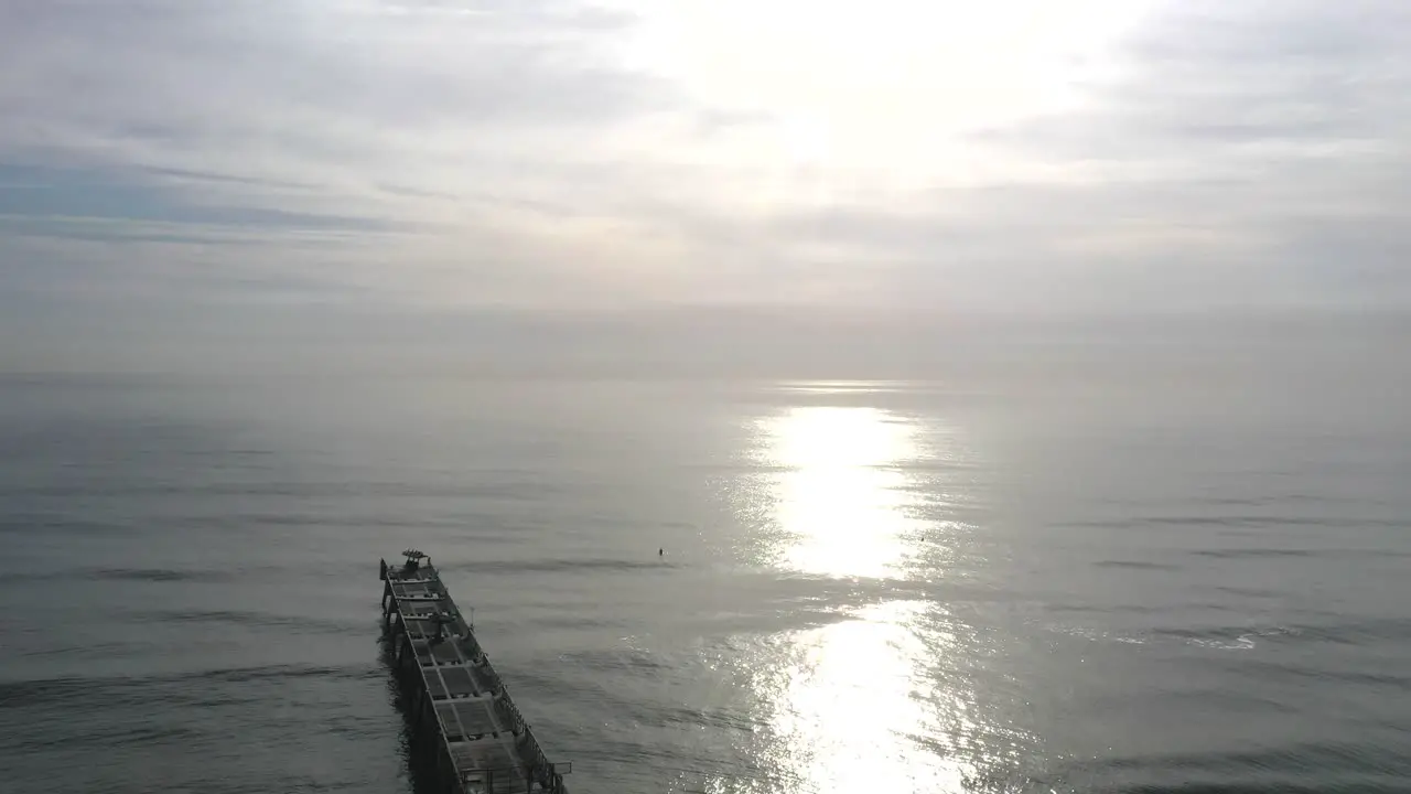 Glistening Waters Of Calm Sea With Jacksonville Beach Pier In Florida USA