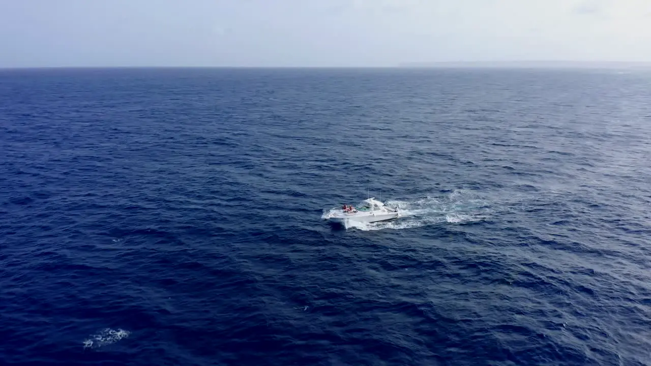 Motorboat sails in blue waters of Cap Cana in Dominican Republic