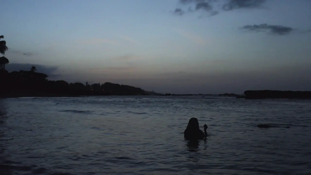 Wanderlust Concept of Woman Wading in Tranquil Ocean Water in Puerto Plata