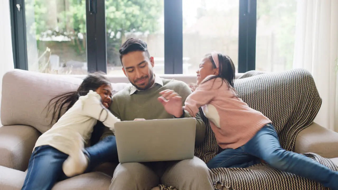 Father typing on laptop while ADHD mental disorder