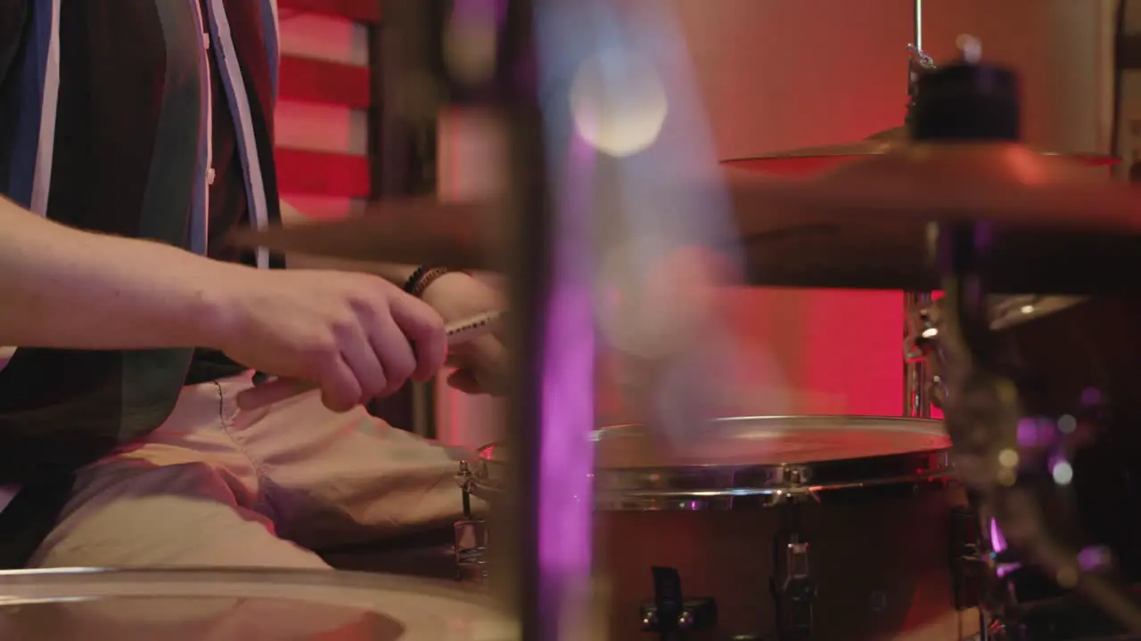 Unrecognizable Man Playing Drums In Recording Studio