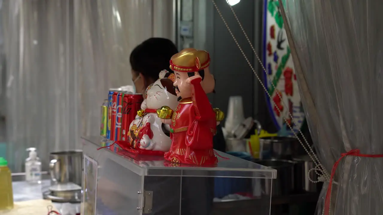 Chai Shen Ye  God of Wealth at street stall Chinatown Singapore