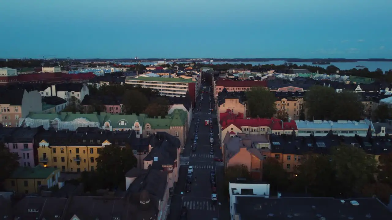 Flight above tidy Scandinavian street on evening in Helsinki Finland