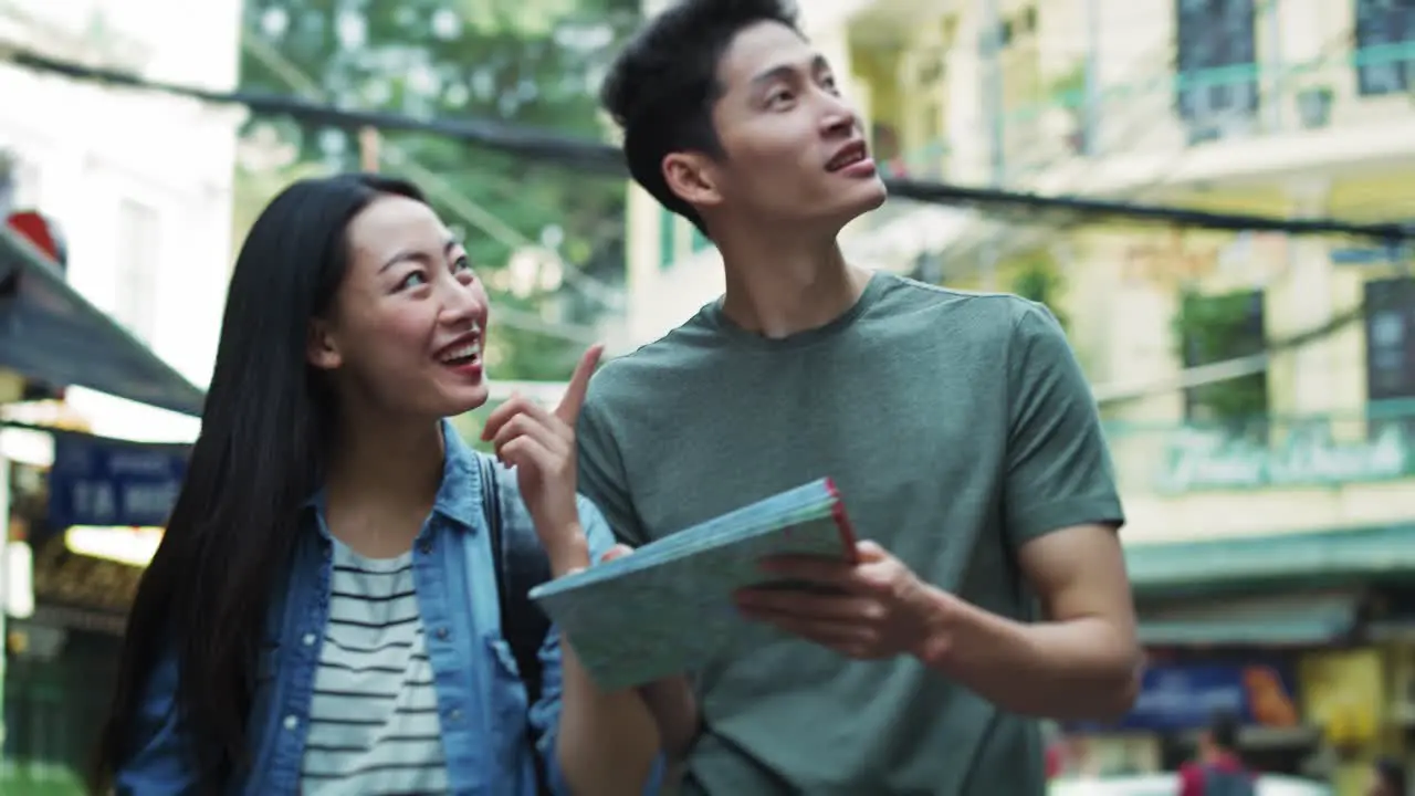 Handheld view of tourists with paper map