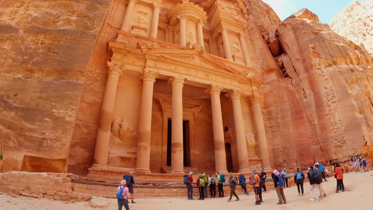 Tourists admiring Treasury in city of Petra Jordan