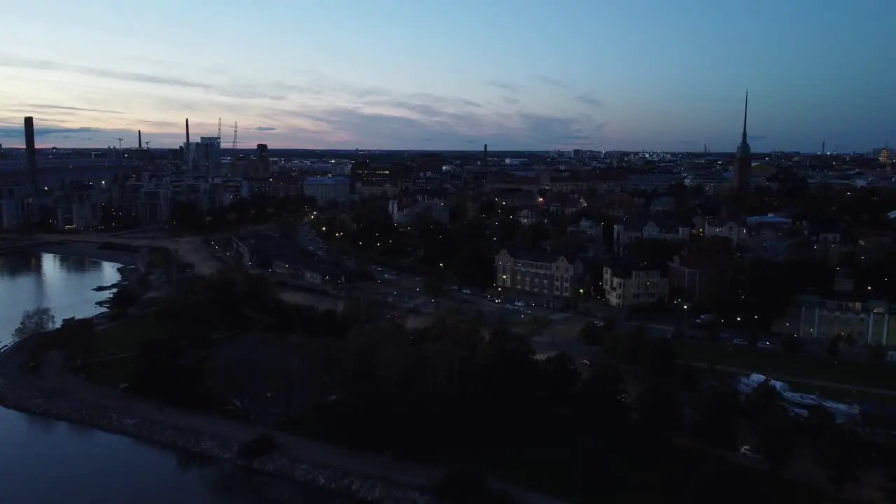 Deep blue light evening waterfront aerial over quiet Helsinki Finland