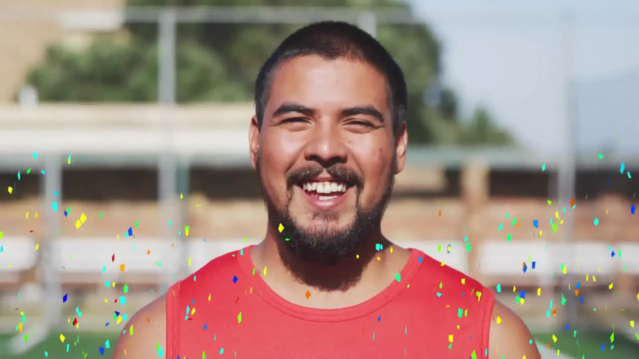 Colorful confetti falling against portrait of male soccer player smiling