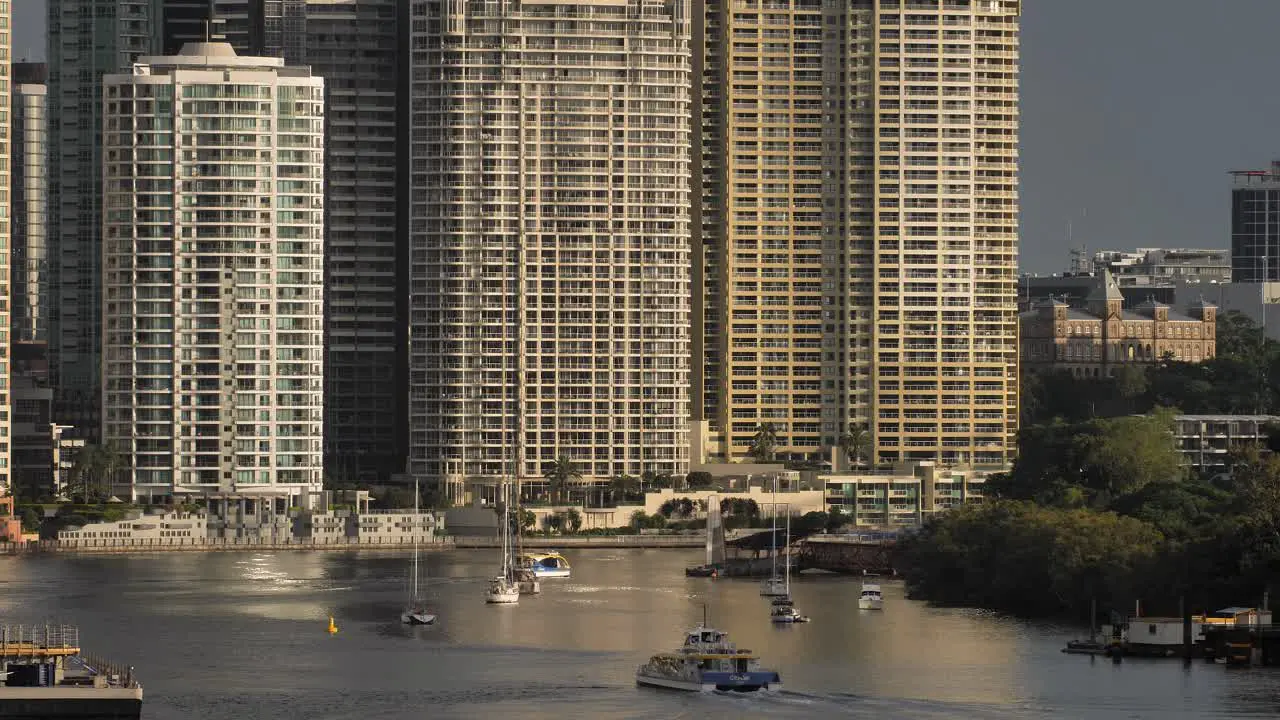 Rivercat on Brisbane River with apartments in the background Brisbane City Queensland Australia