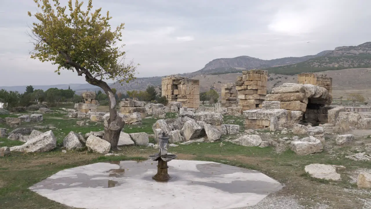 Ancient drinking fountain and ruins of Hierapolis in Pamukkale Turkey