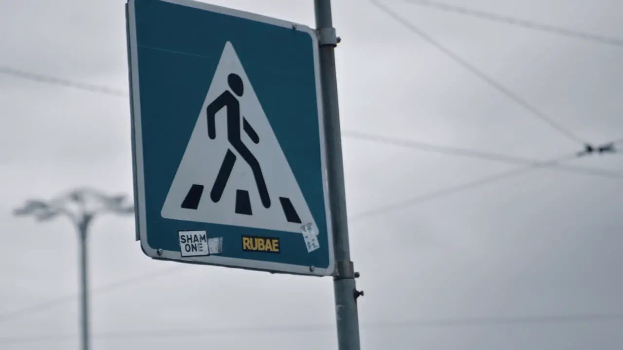 Pedestrian crossing road sign in city backround cloud weather