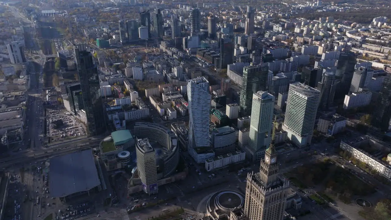 Aerial reveal shot of the Palace of Culture and Science and Warsaw business district