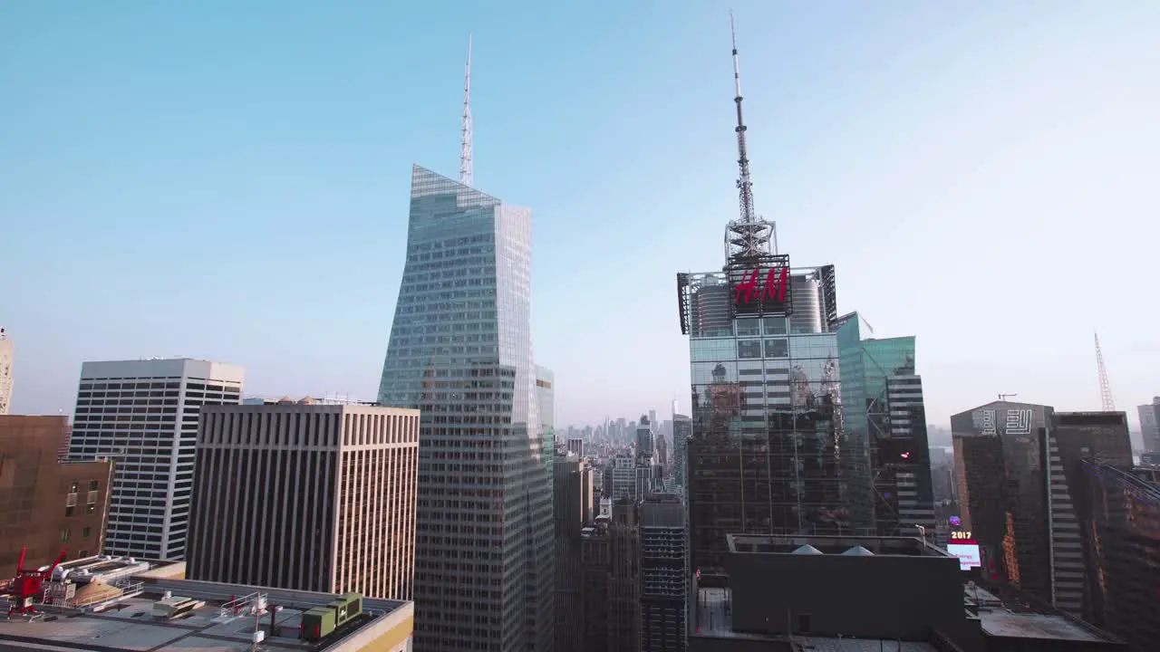 NYC Midtown skyscrapers looking over the length of Manhattan on a clear blue day towards One World Trade in the distance with One Bryant Park and HM Tower in the foreground New York City USA