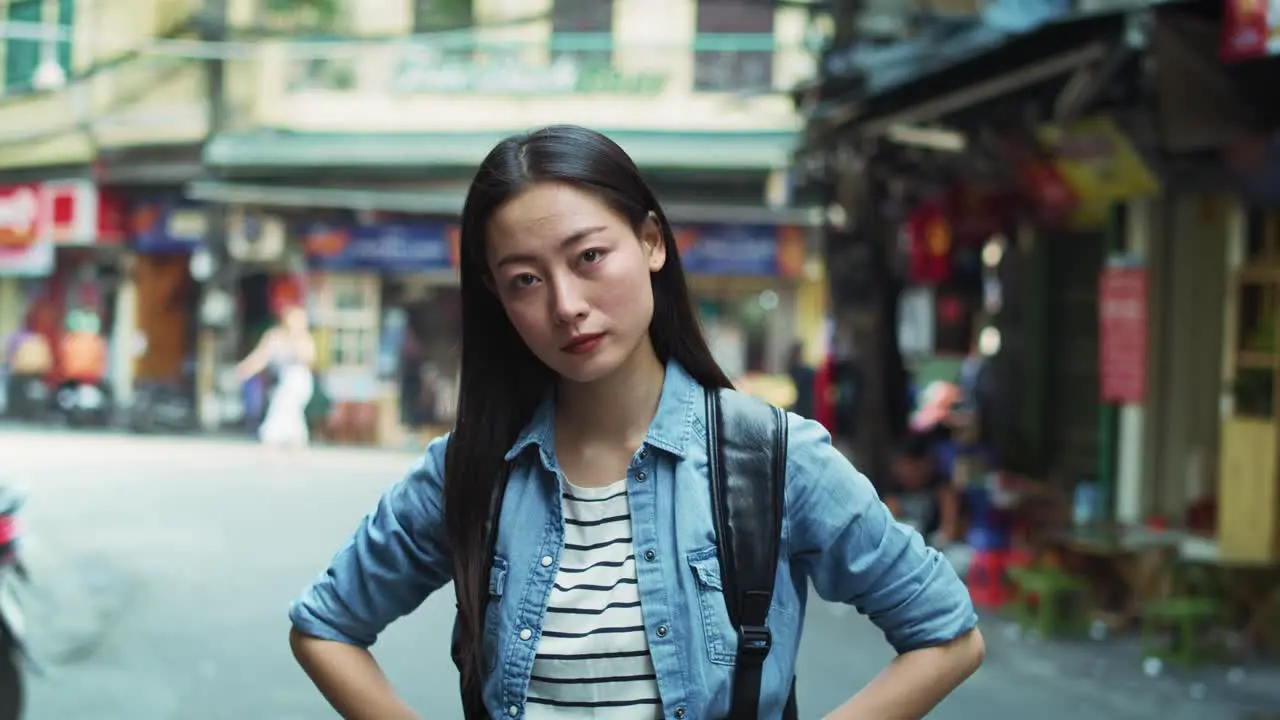 Handheld view of Vietnamese young woman in the city