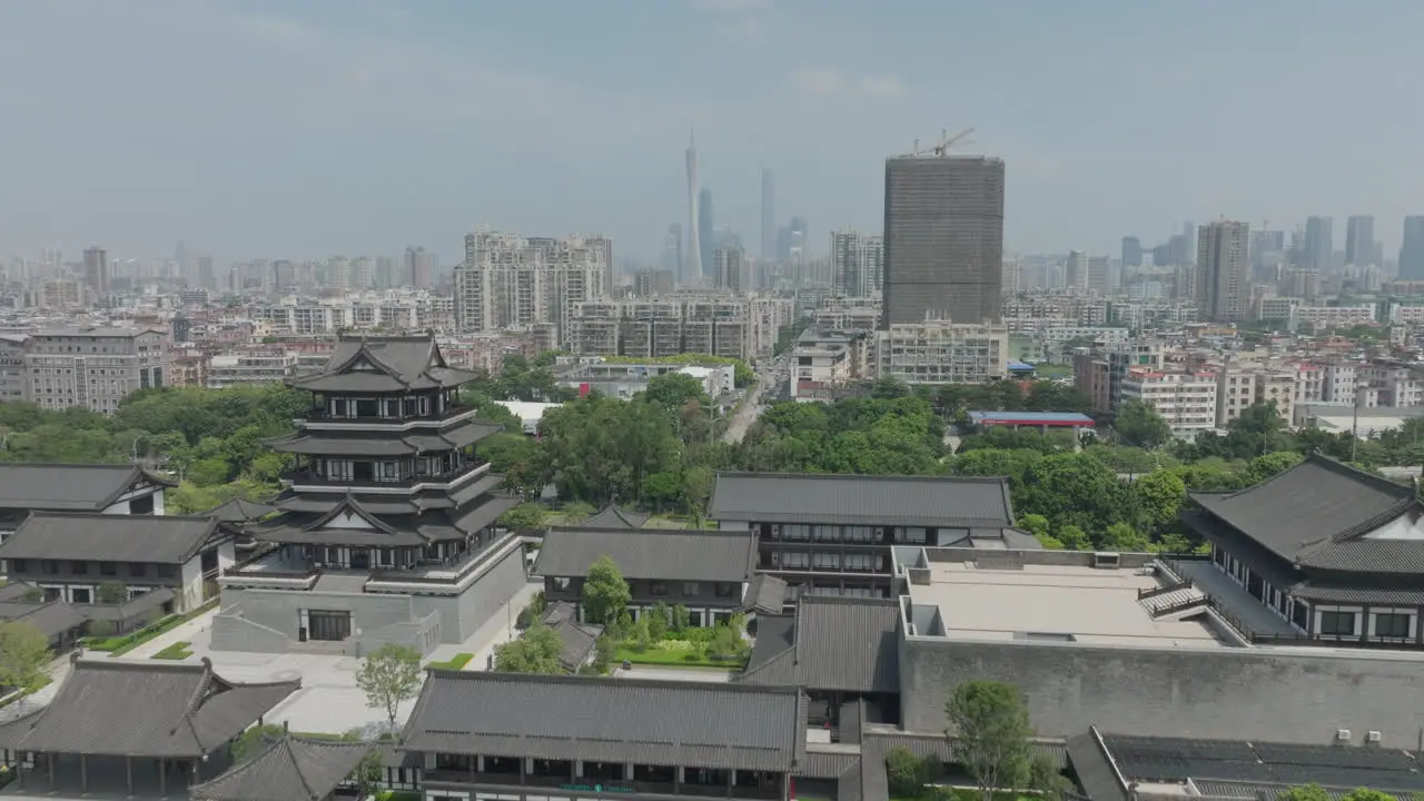 Eastern Chinese heritage town with buildings and a city in the distance