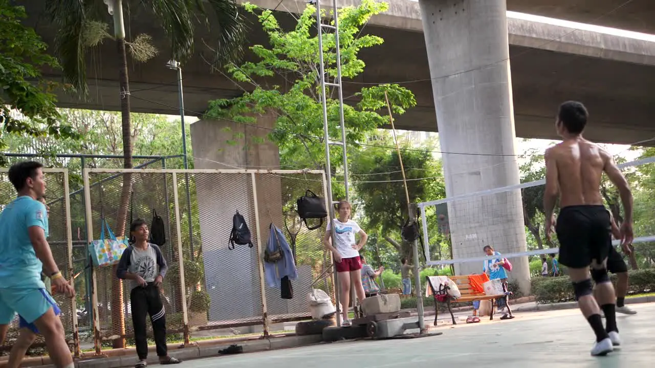 Serving in Sepak Takraw Court Under Highway in Saphan Taksin District of Bangkok Thailand