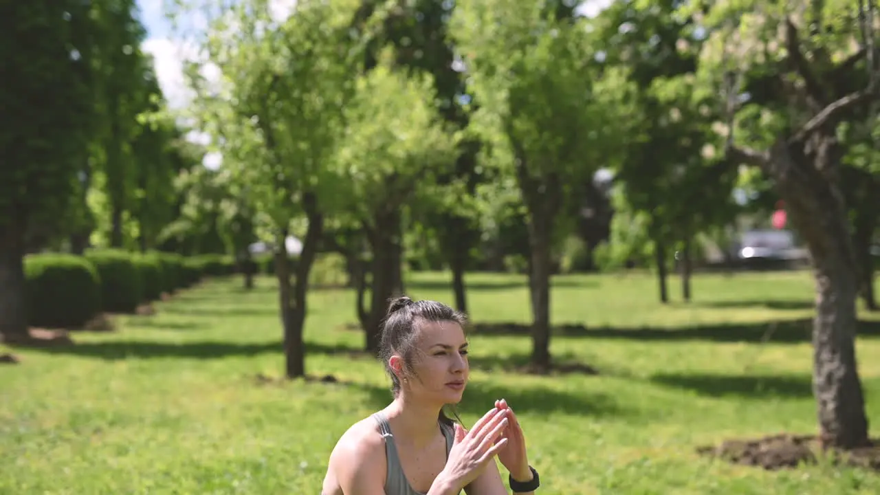 Beautiful Brunette Woman Doing Jump Squats In The Park