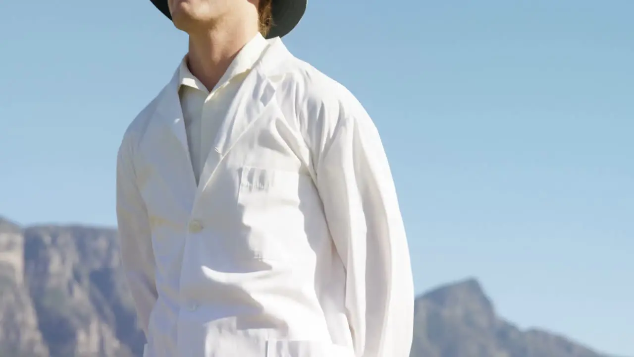 Cricket umpire signaling six during match