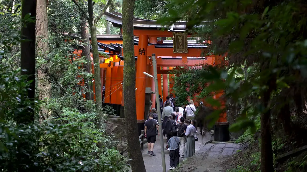 Japanese People And Tourists Walk Fushimi Inari Shrine In Kyoto